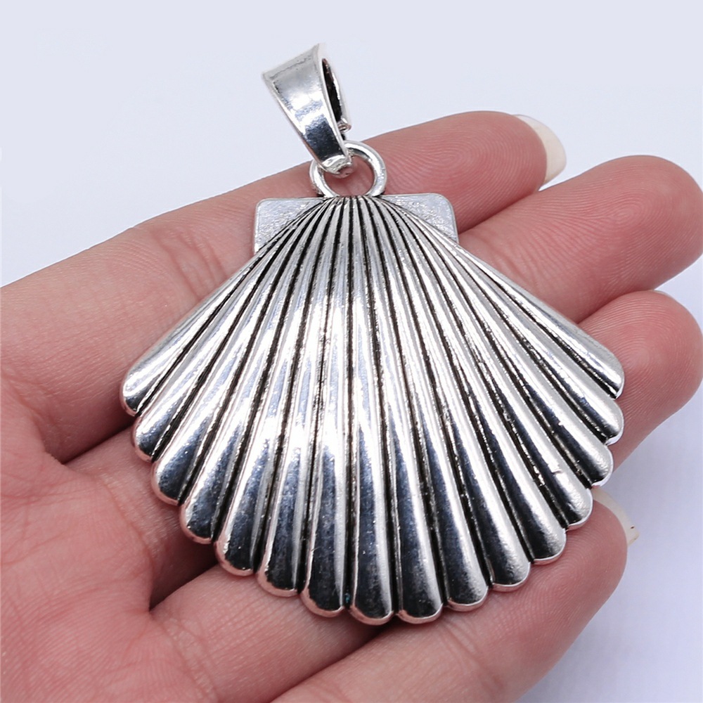 Breloques en forme de coquille - Vintage Fashion Stores avis et prix